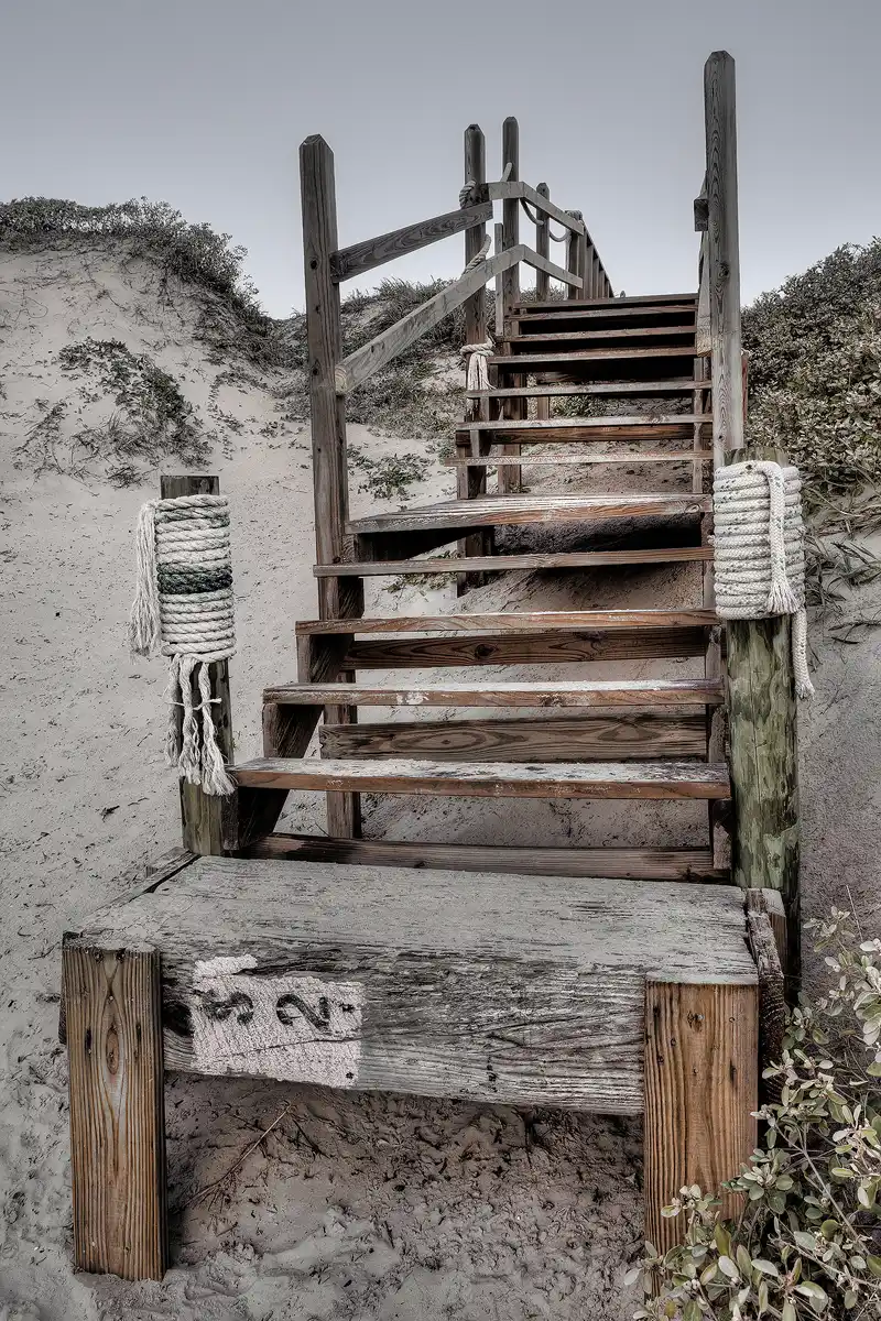 Port Aransas Dunes: Weathered Stairs to the Crest Port Aransas, Texas, beach stairs leading to dune crest with subdued colors.
