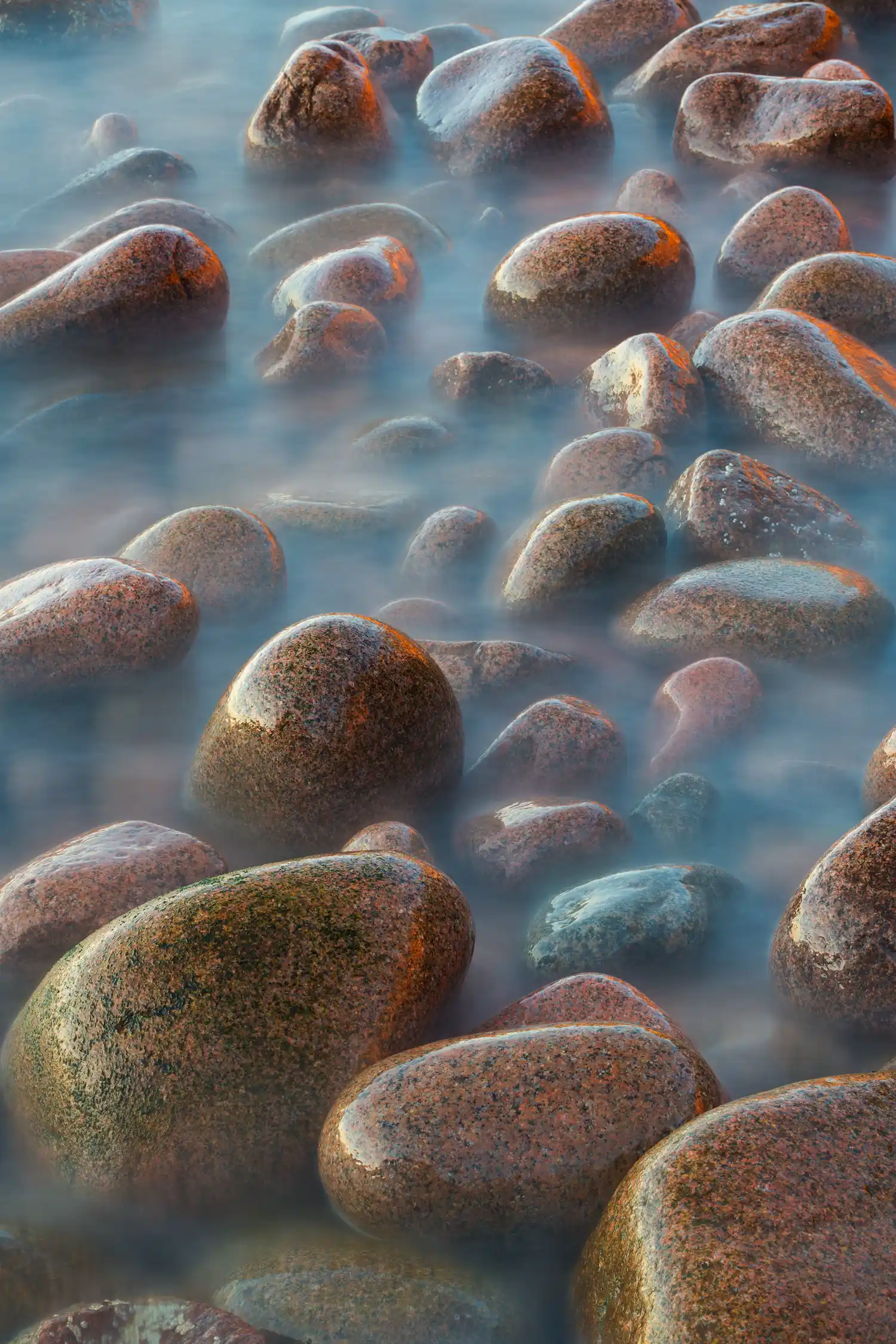 Smooth boulders on a beach in Acadia National Park.