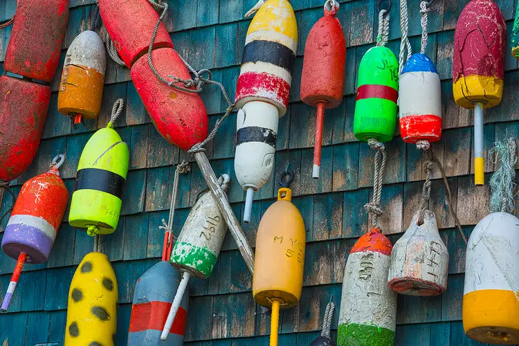 Colorful lobster buoys on a building in Acadia National Park.