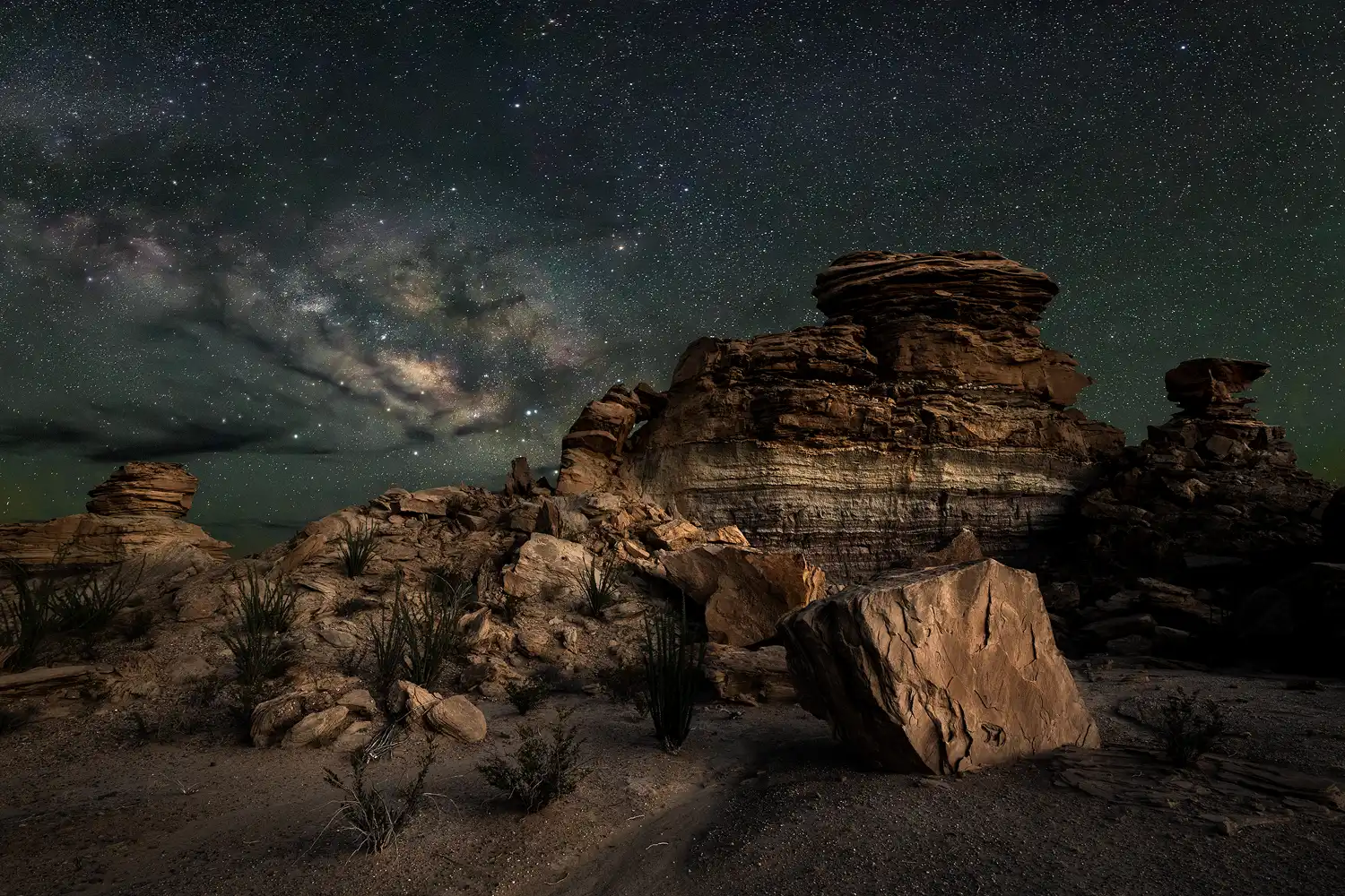 Milky Way above layered sandstone formations near Exhibit Ridge in Big Bend National Park, Texas.