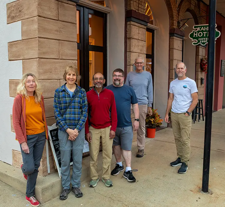 Group photo of photography workshop participants at the Kahn Hotel in Jefferson, Texas.