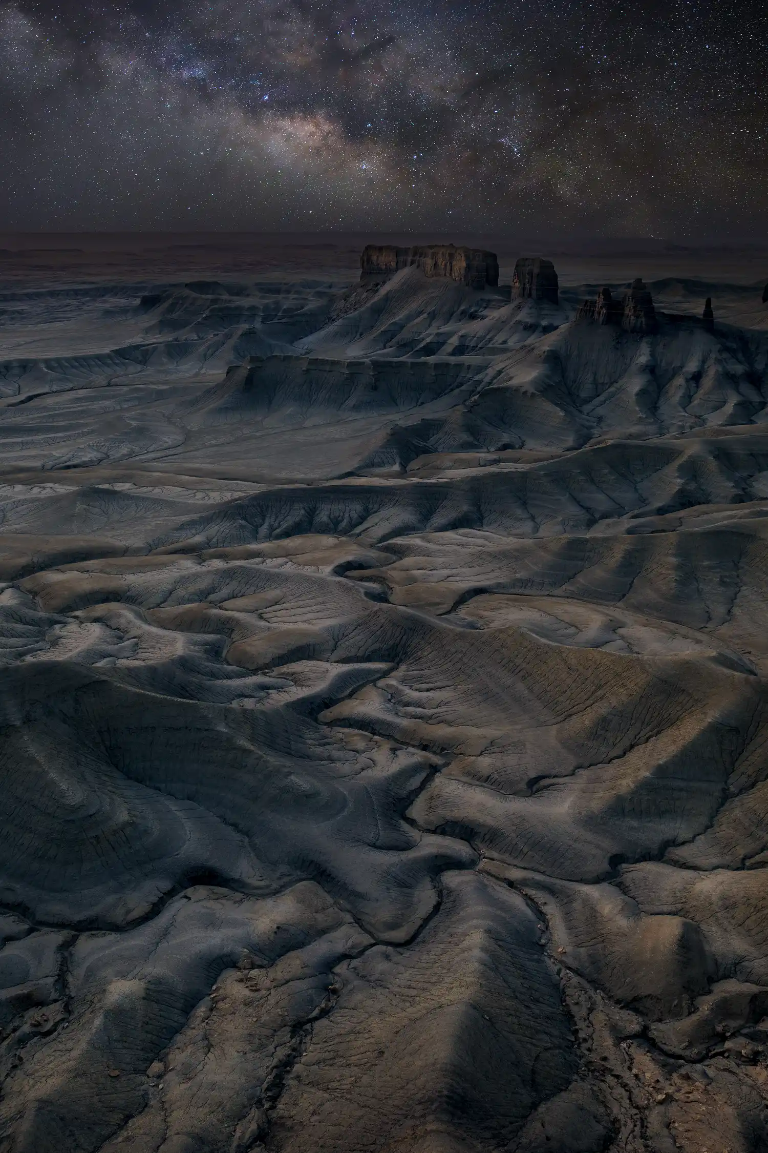 Milky Way rising above desert buttes at Moonscape Overlook, Utah, photographed as a composite.