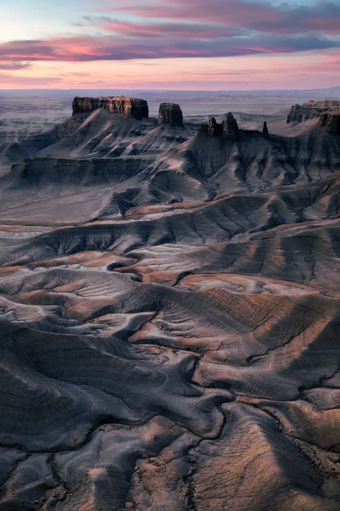 Badlands and eroded clay formations at sunrise from Moonscape Overlook near Hanksville, Utah.