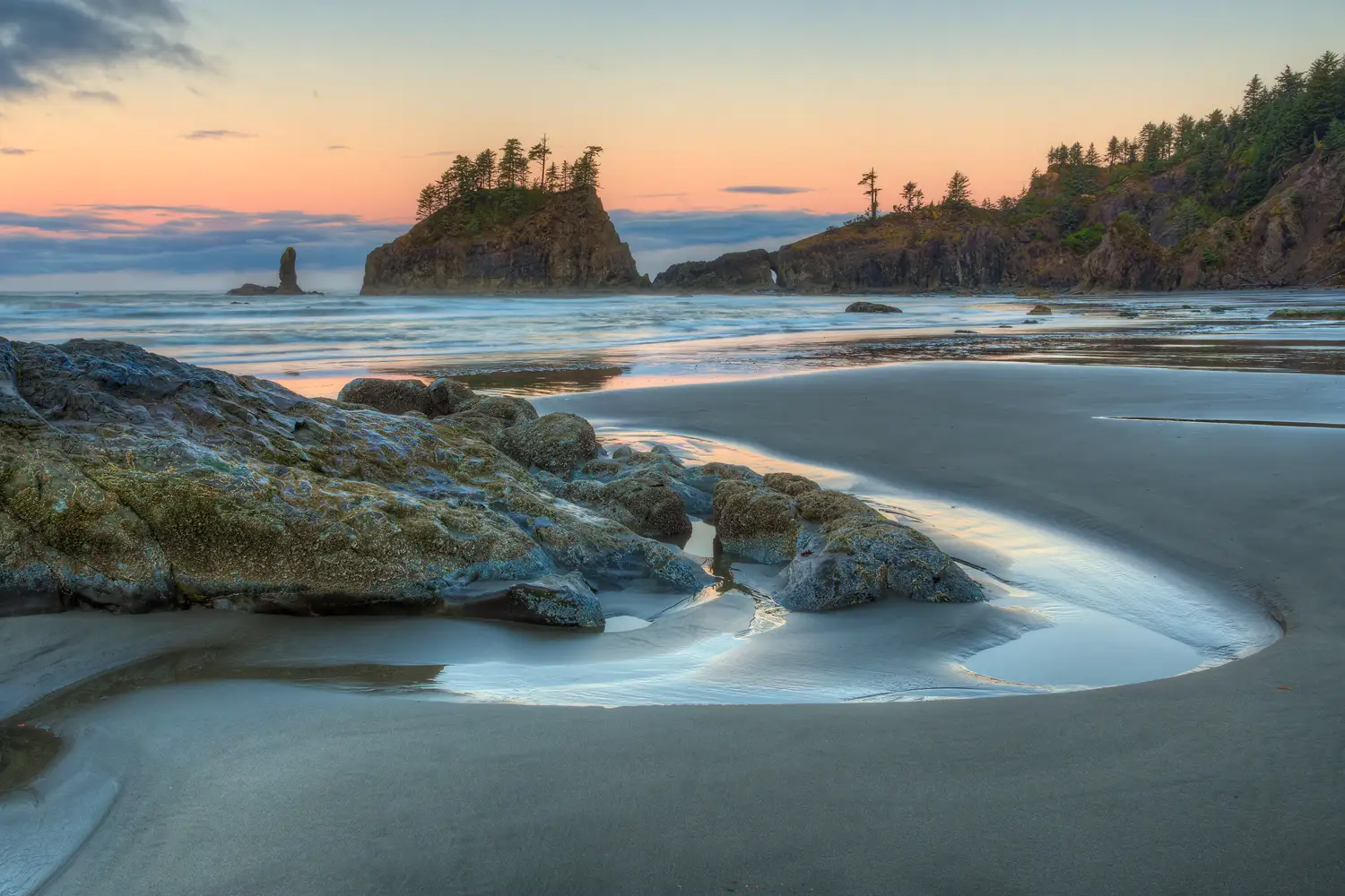 Sunrise at Second Beach in Olympic National Park with sea stacks and tide pools.