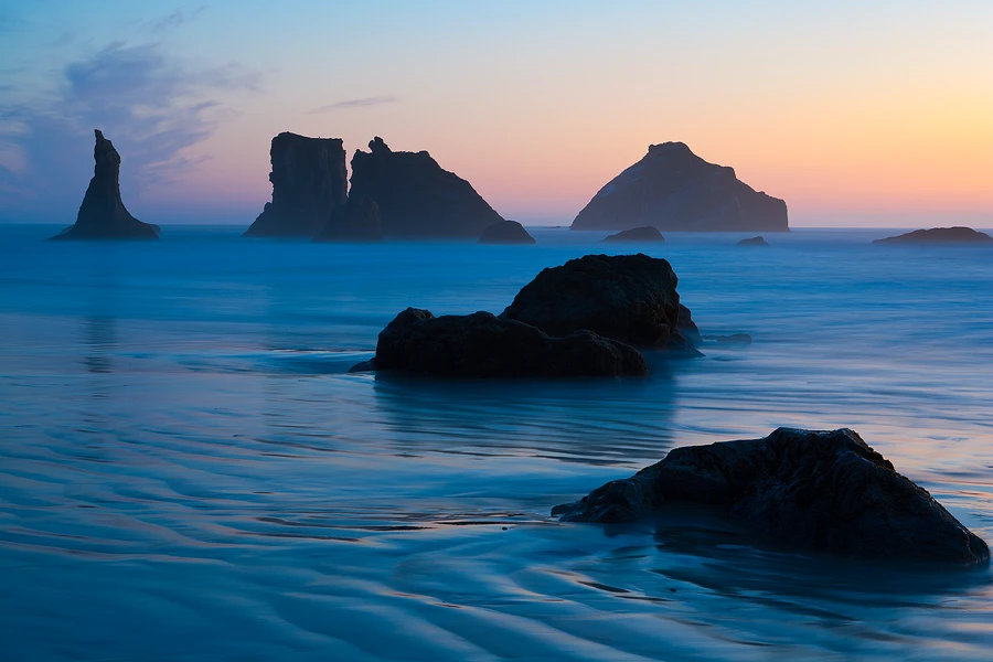 Oregon Coast Photography Workshop: Rugged coastline with sea stacks and scenic beaches.
