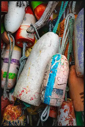 Cluster of colorful fishing buoys, Oregon Coast. Close-up photo by Harriet Feagin.