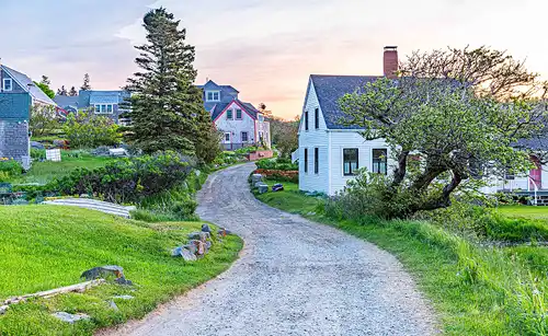 Dirt lane, historic buildings, Monhegan Island, Maine. Morning light. Photo by James Gheida.