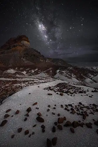 Milky Way over Cerro Castellan, Big Bend. Night sky with white ash and red rocks. Photo by Dale Sullivan.