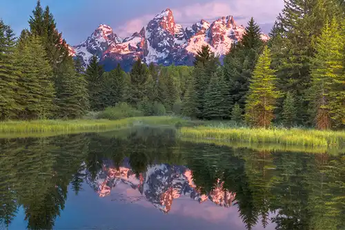 Sunrise at Schwabacher Landing, Grand Tetons. Mountain reflection in water. Photo by Richard Stolarski.