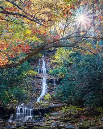 Tom Branch Falls, autumn leaves, Great Smoky Mountains. Morning starburst. Photo by Mark Leatherman.